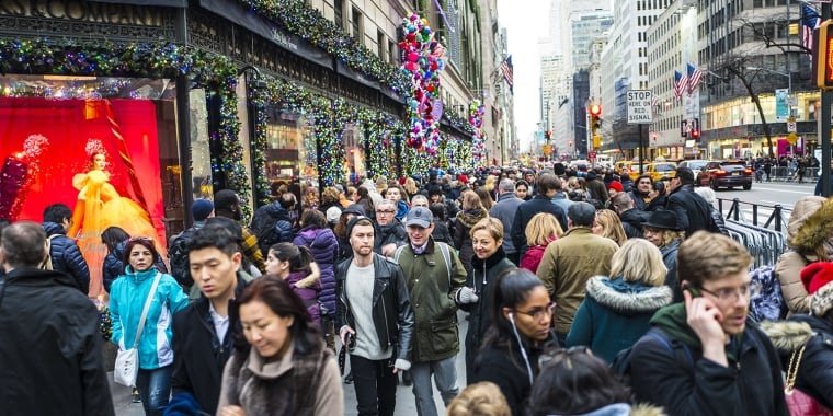 Christmas shoppers filling the sidewalks of Fifth Avenue with just two days of Christmas shopping before the holiday.