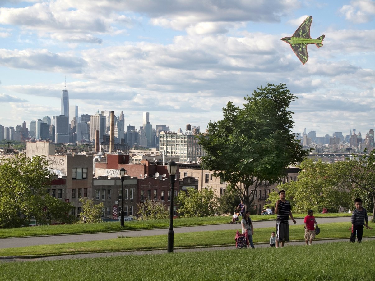 Children flying a kite in the Sunset Park neighborhood of Brooklyn, New York City, USA 